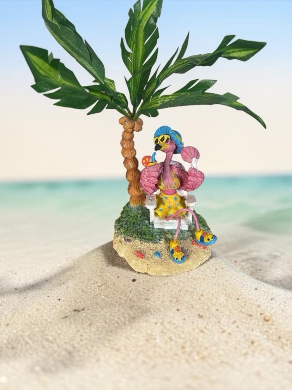 Tropical 🏝️ ceramic flamingo 🦩 with palm.